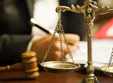 Lawyer-with-Scales-of-Justice-thumbnail